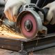 Angle grinder cutting metal with sparks flying